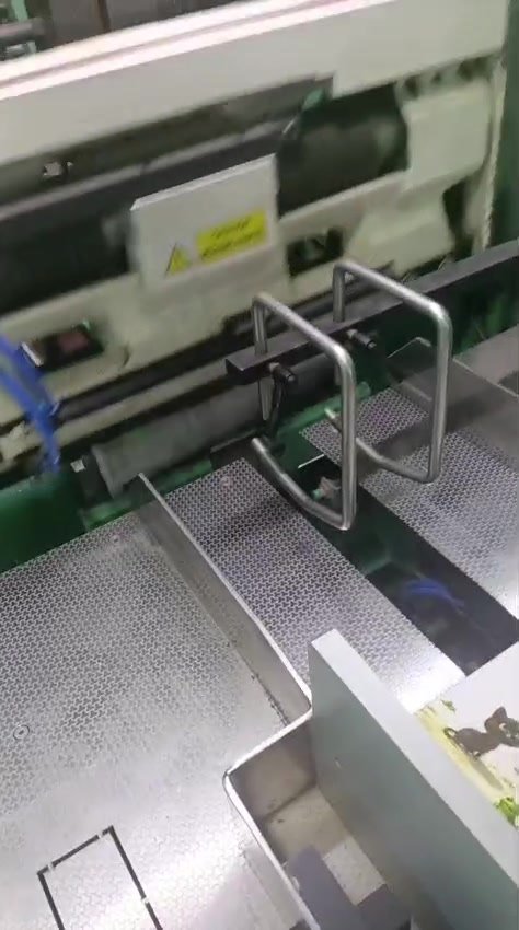Delivery section where finished books exit the machine